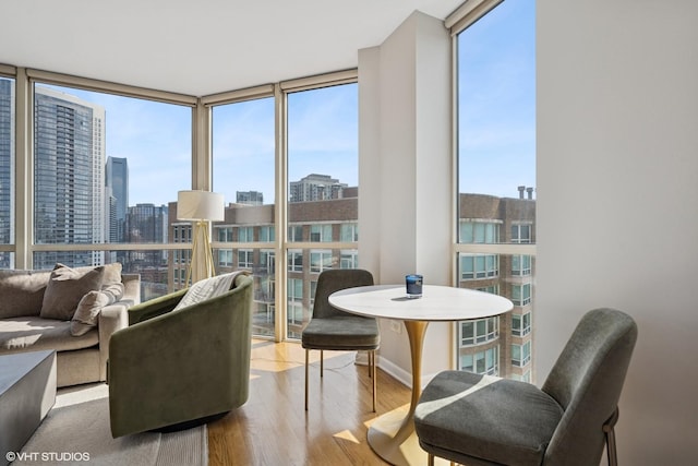 645 N Kingsbury St Unit 2002, Chicago, IL 60654 - sitting room featuring a wall of windows, plenty of natural light, wood finished floors, and a view of city