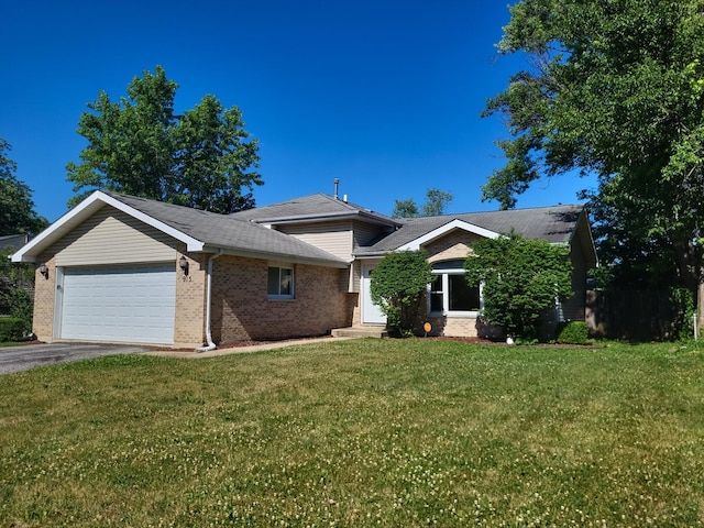 913 Dartmouth Ave, Matteson, IL 60443 - view of front facade with an attached garage, brick siding, a front yard, asphalt driveway, and roof with shingles