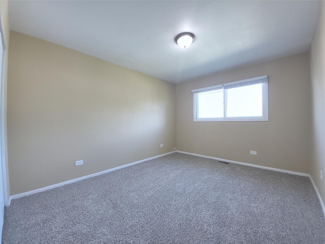 913 Dartmouth Ave, Matteson, IL 60443 - spare room featuring carpet and baseboards