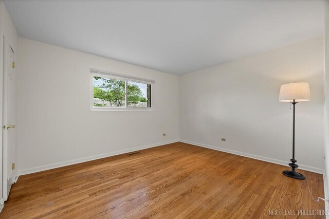 208 Kenston Ct Unit 208, Geneva, IL 60134 - unfurnished room with baseboards and light wood-type flooring