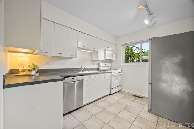 208 Kenston Ct Unit 208, Geneva, IL 60134 - kitchen featuring stainless steel appliances, white cabinets, dark countertops, and light tile patterned flooring
