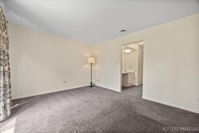208 Kenston Ct Unit 208, Geneva, IL 60134 - empty room featuring dark colored carpet and baseboards