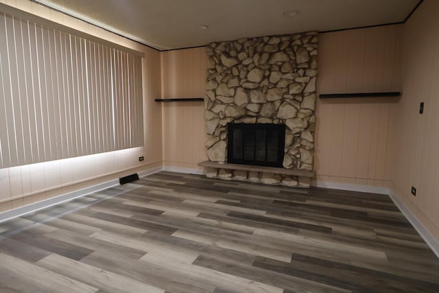8818 Lori Ln, Orland Park, IL 60462 - unfurnished living room with wood finished floors and a stone fireplace