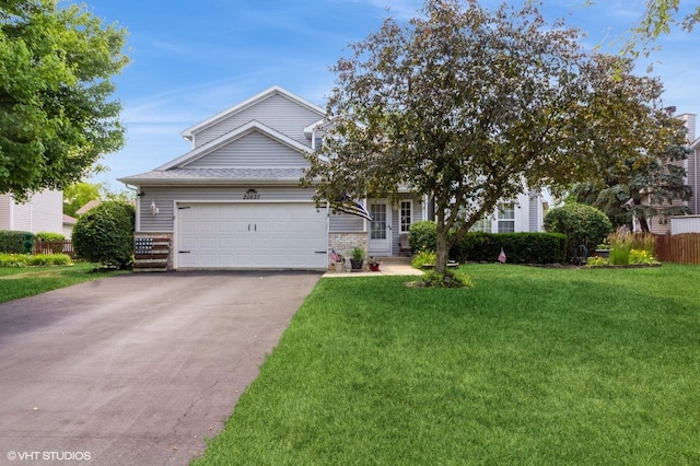 25637 S Fieldstone Ct, Channahon, IL 60410 - obstructed view of property with driveway, a garage, and a front yard