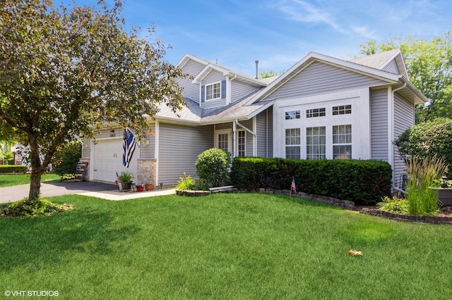 25637 S Fieldstone Ct, Channahon, IL 60410 - traditional-style house with a front lawn, asphalt driveway, an attached garage, and a shingled roof