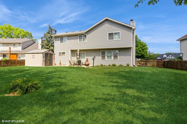25637 S Fieldstone Ct, Channahon, IL 60410 - rear view of property with a storage unit, a chimney, a fenced backyard, and a patio area