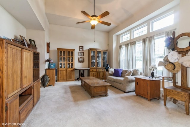 25637 S Fieldstone Ct, Channahon, IL 60410 - living area with light carpet, a ceiling fan, and a high ceiling