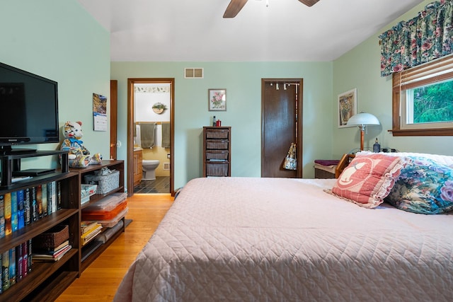 9108 Windsor Dr, Palos Hills, IL 60465 - bedroom featuring wood finished floors, connected bathroom, and a ceiling fan
