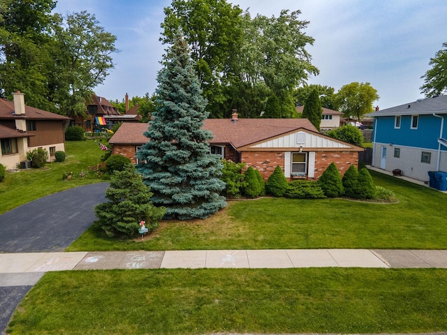 9108 Windsor Dr, Palos Hills, IL 60465 - view of front of property with brick siding, a front yard, and board and batten siding