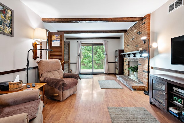 9108 Windsor Dr, Palos Hills, IL 60465 - living room featuring wood finished floors, beamed ceiling, and a fireplace
