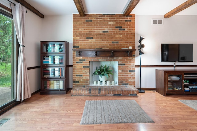 9108 Windsor Dr, Palos Hills, IL 60465 - living room featuring a fireplace, beam ceiling, and wood finished floors