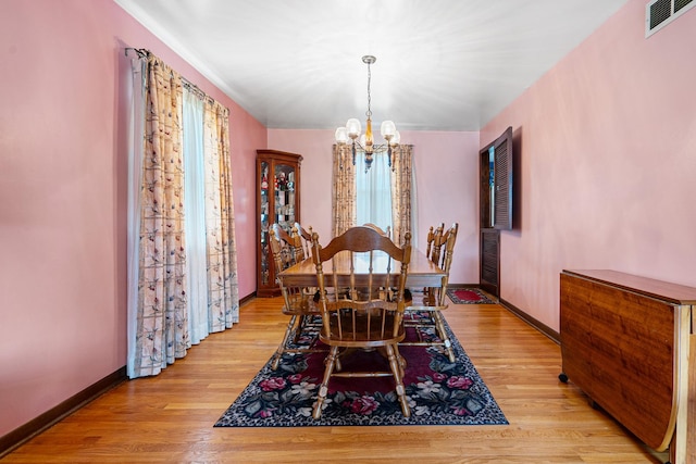 9108 Windsor Dr, Palos Hills, IL 60465 - dining area with a chandelier and light wood-style floors