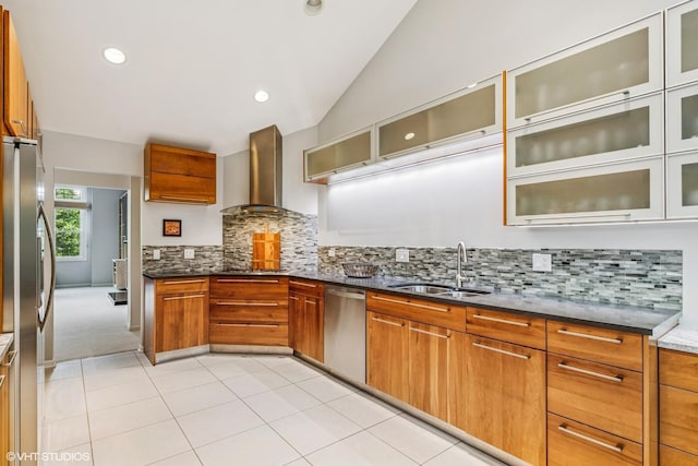 315 Princeton Ln, Glenview, IL 60026 - kitchen featuring appliances with stainless steel finishes, wall chimney range hood, vaulted ceiling, brown cabinets, and dark stone counters