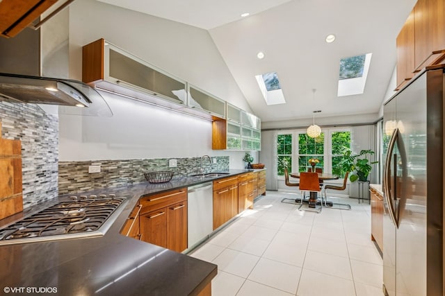 315 Princeton Ln, Glenview, IL 60026 - kitchen with stainless steel appliances, wall chimney range hood, vaulted ceiling, dark countertops, and tasteful backsplash