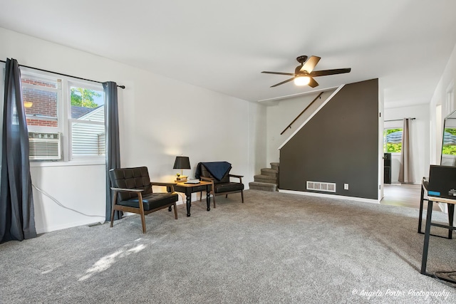 5535 Wonder Woods Dr, Wonder Lake, IL 60097 - living area featuring carpet, stairway, and ceiling fan