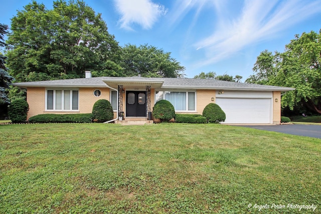 4725 Winnebago Dr, Wonder Lake, IL 60097 - single story home featuring brick siding, driveway, a garage, and a front yard