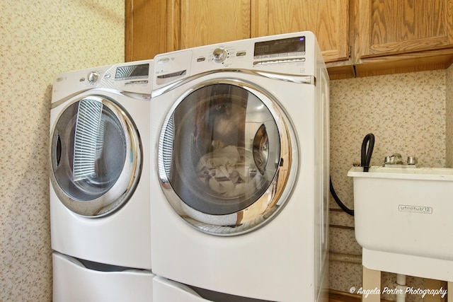 4725 Winnebago Dr, Wonder Lake, IL 60097 - laundry room featuring cabinet space and washer and dryer