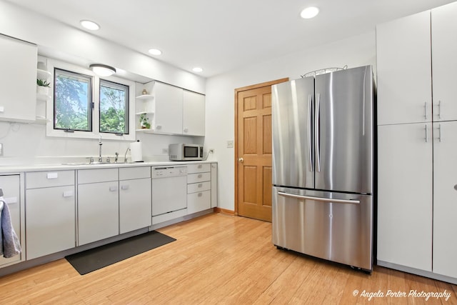 4725 Winnebago Dr, Wonder Lake, IL 60097 - kitchen featuring white appliances, open shelves, white cabinets, light wood finished floors, and light countertops