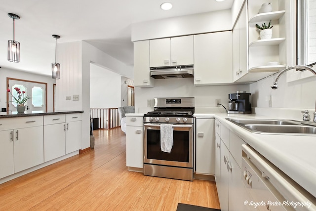 4725 Winnebago Dr, Wonder Lake, IL 60097 - kitchen featuring stainless steel gas range, under cabinet range hood, white dishwasher, light wood-style floors, and recessed lighting