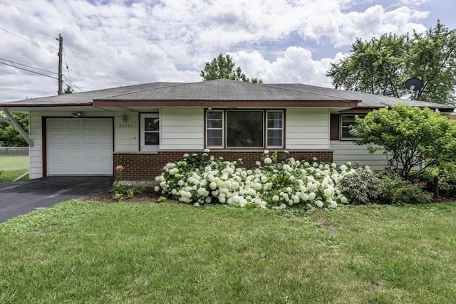 22271 W Terry Dr S, Lake Villa, IL 60046 - ranch-style home with brick siding, an attached garage, driveway, and a front lawn