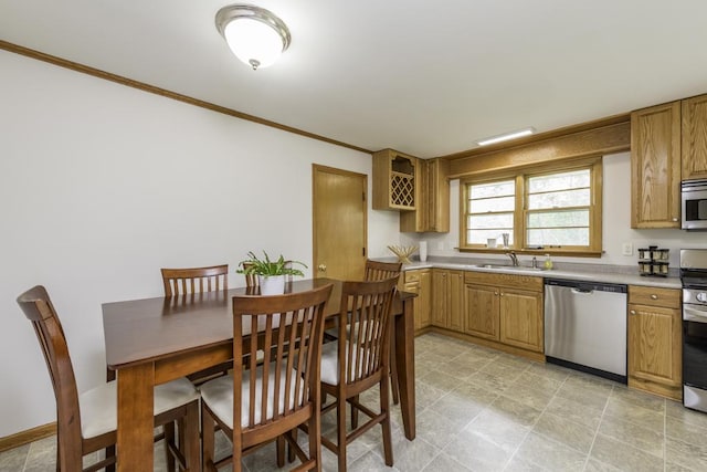 22271 W Terry Dr S, Lake Villa, IL 60046 - kitchen with stainless steel appliances, ornamental molding, light countertops, and brown cabinets