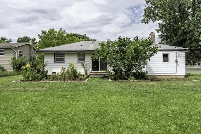 22271 W Terry Dr S, Lake Villa, IL 60046 - rear view of house featuring a lawn and a chimney