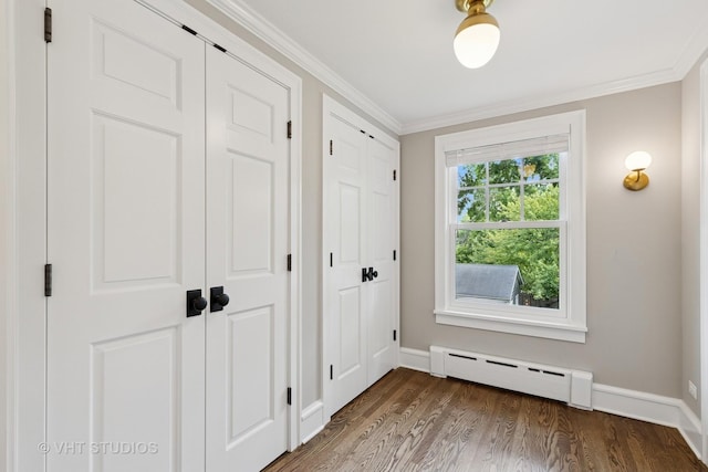 2539 Marcy Ave, Evanston, IL 60201 - entryway featuring a baseboard heating unit, dark wood-type flooring, and crown molding