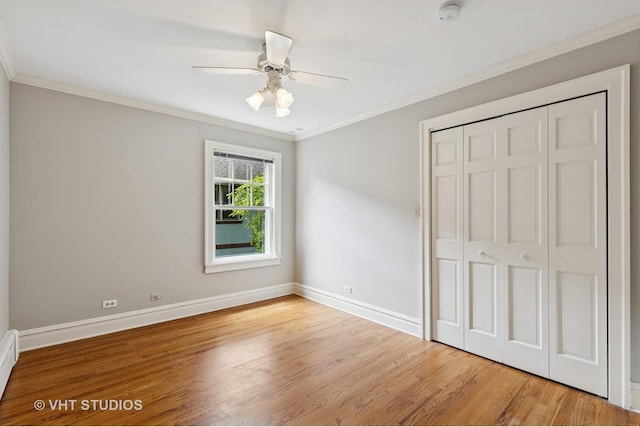 2539 Marcy Ave, Evanston, IL 60201 - unfurnished bedroom featuring ornamental molding, wood finished floors, a closet, and a ceiling fan