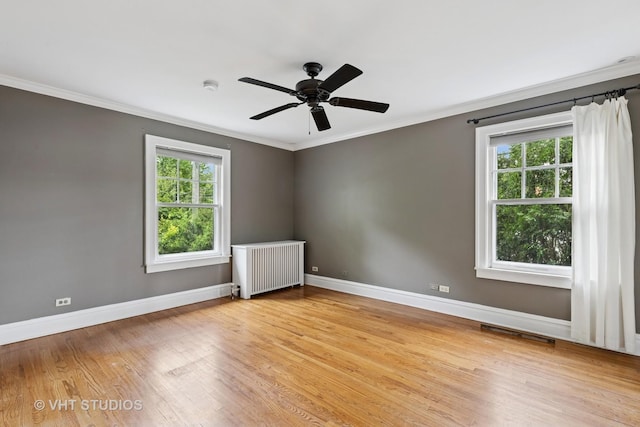 2539 Marcy Ave, Evanston, IL 60201 - empty room with radiator heating unit, ornamental molding, light wood finished floors, a ceiling fan, and a smoke detector