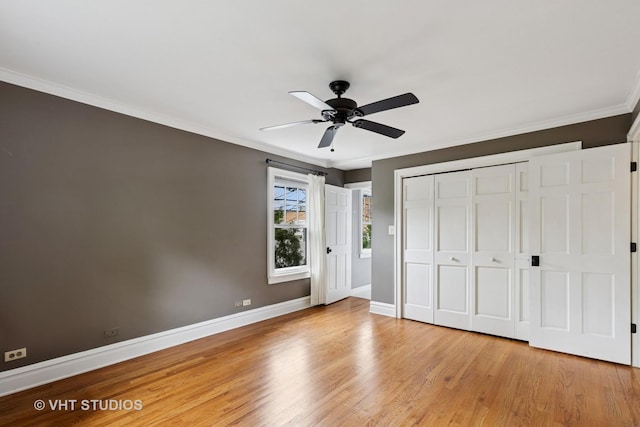 2539 Marcy Ave, Evanston, IL 60201 - unfurnished bedroom with crown molding, wood finished floors, a closet, and ceiling fan