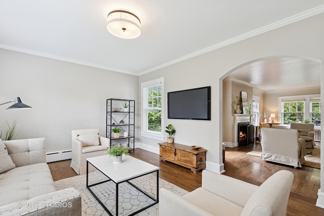 2539 Marcy Ave, Evanston, IL 60201 - living room with baseboard heating, arched walkways, healthy amount of natural light, wood finished floors, and crown molding