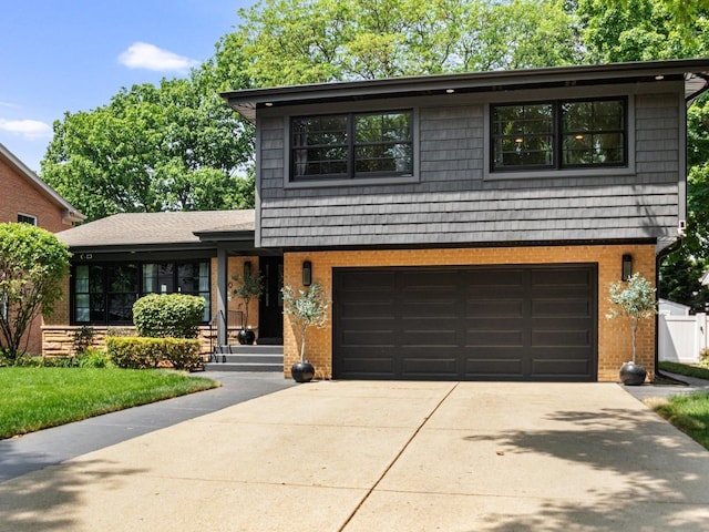 400 S Rose Ave, Park Ridge, IL 60068 - tri-level home with brick siding, concrete driveway, and an attached garage