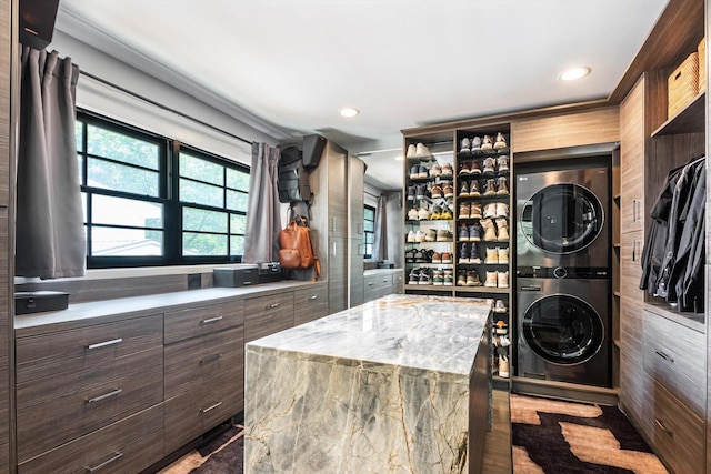 400 S Rose Ave, Park Ridge, IL 60068 - laundry area featuring stacked washing machine and dryer, recessed lighting, and wood walls