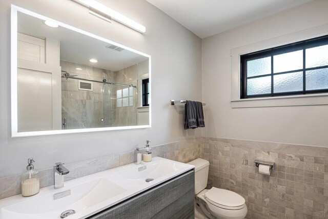 400 S Rose Ave, Park Ridge, IL 60068 - full bathroom featuring tile walls, a tile shower, double vanity, and wainscoting