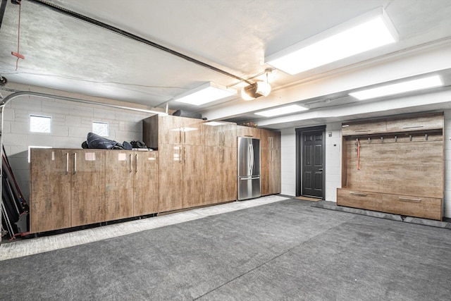 400 S Rose Ave, Park Ridge, IL 60068 - garage with freestanding refrigerator, concrete block wall, and a garage door opener