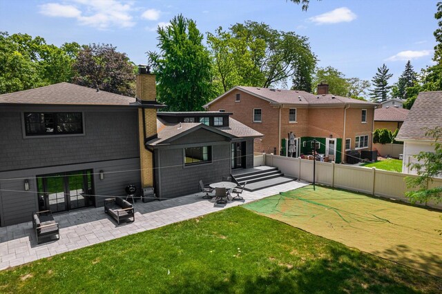 400 S Rose Ave, Park Ridge, IL 60068 - back of property featuring a patio area, a chimney, and a shingled roof