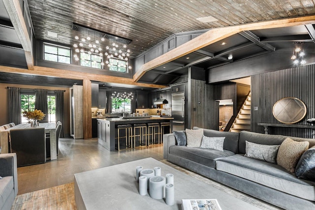 400 S Rose Ave, Park Ridge, IL 60068 - living area with light wood-style flooring, wood walls, high vaulted ceiling, and stairway