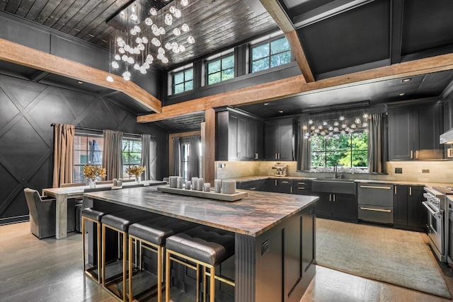 400 S Rose Ave, Park Ridge, IL 60068 - kitchen with wooden counters, light wood-style flooring, dark cabinetry, decorative backsplash, and dishwashing machine