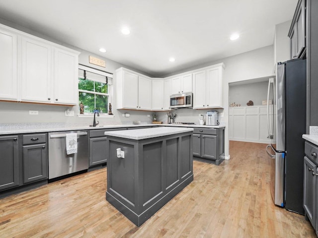 210 Woodford Rd, Oswego, IL 60543 - kitchen featuring stainless steel appliances, gray cabinetry, light countertops, and recessed lighting