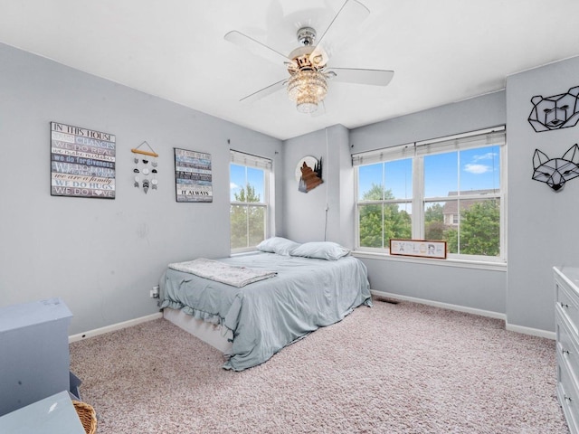 210 Woodford Rd, Oswego, IL 60543 - carpeted bedroom featuring baseboards and a ceiling fan