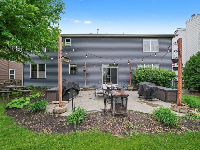 210 Woodford Rd, Oswego, IL 60543 - back of house with a patio