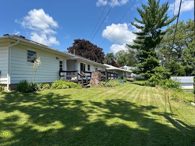 110 Shady Ln, Dixon, IL 61021 - view of grassy yard with a deck