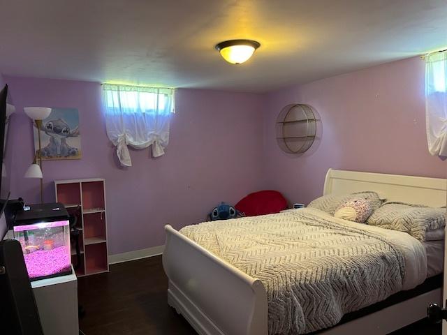 110 Shady Ln, Dixon, IL 61021 - bedroom with dark wood-style floors and baseboards