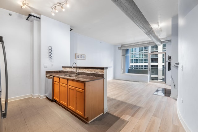 1305 S Michigan Ave Unit 807, Chicago, IL 60605 - kitchen featuring a peninsula, dishwasher, brown cabinetry, dark stone countertops, and open floor plan