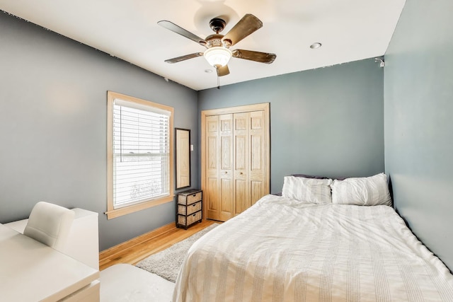 5836 N Oconto Ave, Chicago, IL 60631 - bedroom featuring wood finished floors, a closet, and ceiling fan