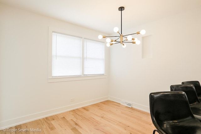 7939 Neva Ave, Burbank, IL 60459 - home office with a chandelier and light wood-type flooring