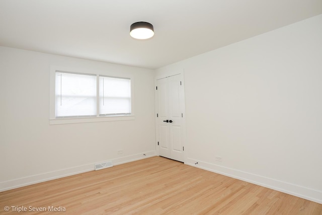 7939 Neva Ave, Burbank, IL 60459 - unfurnished room featuring wood finished floors and baseboards