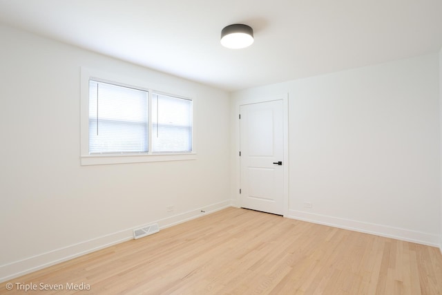7939 Neva Ave, Burbank, IL 60459 - unfurnished room featuring light wood finished floors and baseboards