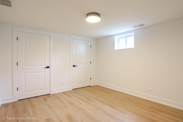 7939 Neva Ave, Burbank, IL 60459 - below grade area with light wood finished floors and baseboards