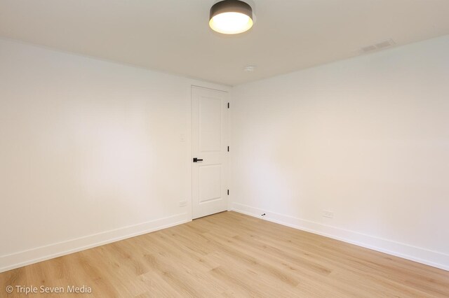 7939 Neva Ave, Burbank, IL 60459 - empty room with light wood-style flooring and baseboards